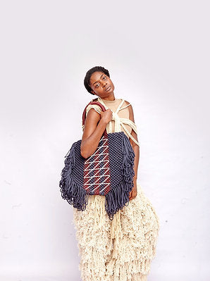 Maphosa Top Handle bag with familiar shaggy tassels