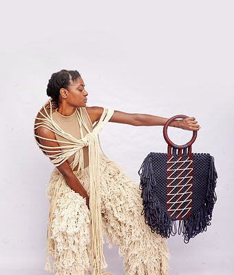 Maphosa Top Handle bag with familiar shaggy tassels