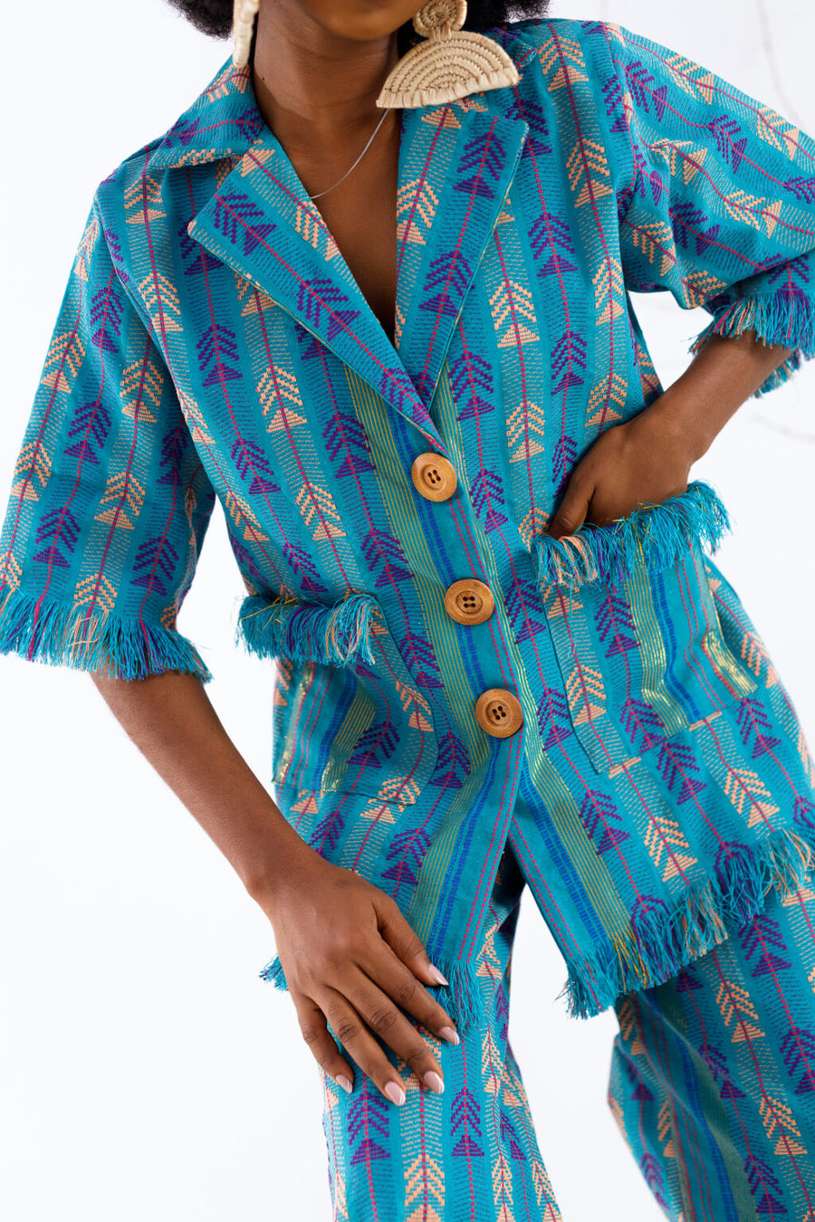 Atuche Osisi wooden set with an oversized shirt and trousers