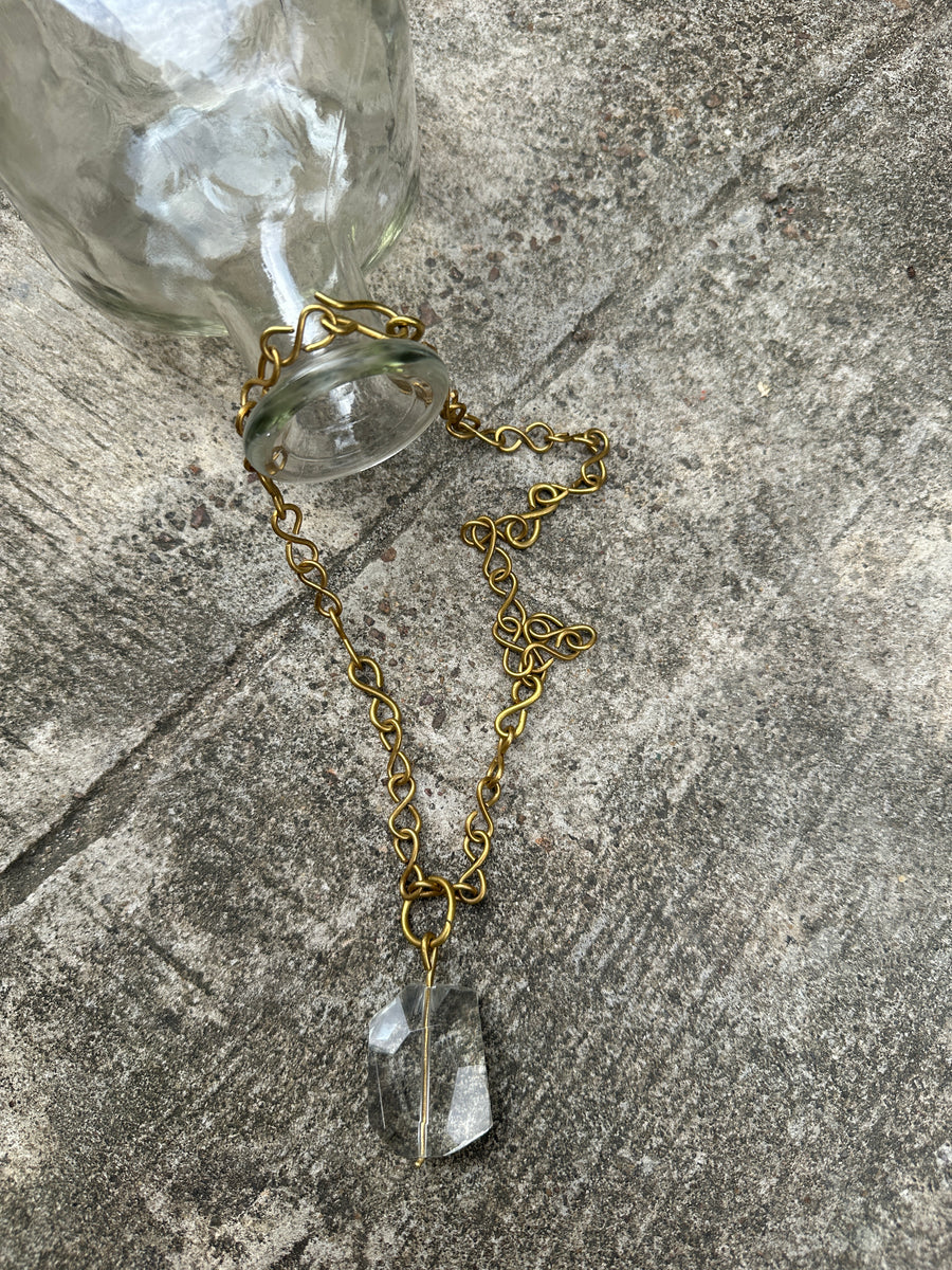 Renikeji Keji Necklace with a clear glass pendant