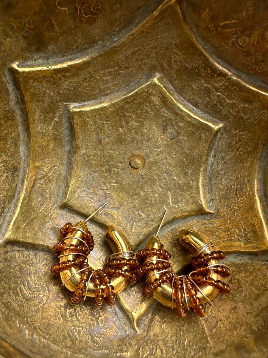 Renikeji Choc Chip Hoop Earrings with Brown seed beads wrapped around a gold-plated hoop