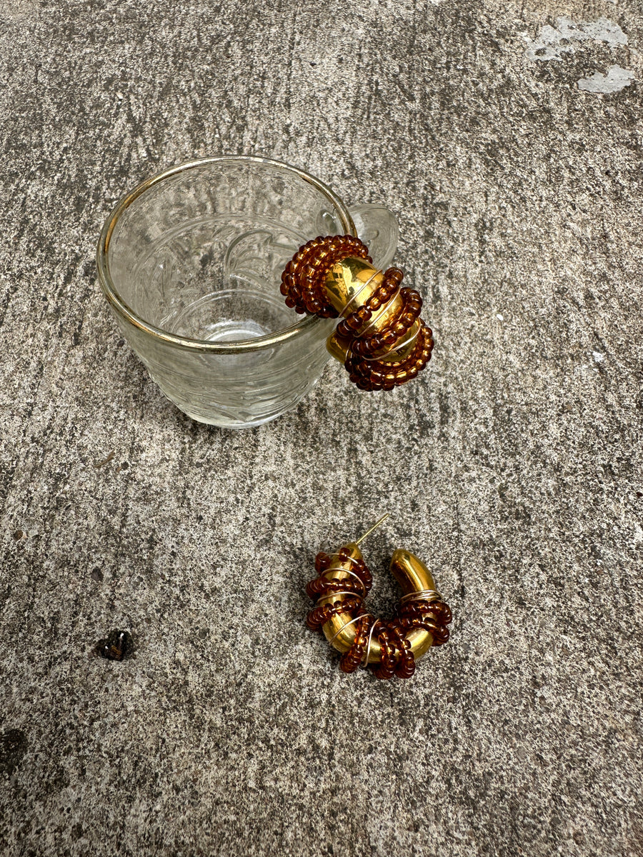 Renikeji Choc Chip Hoop Earrings with Brown seed beads wrapped around a gold-plated hoop