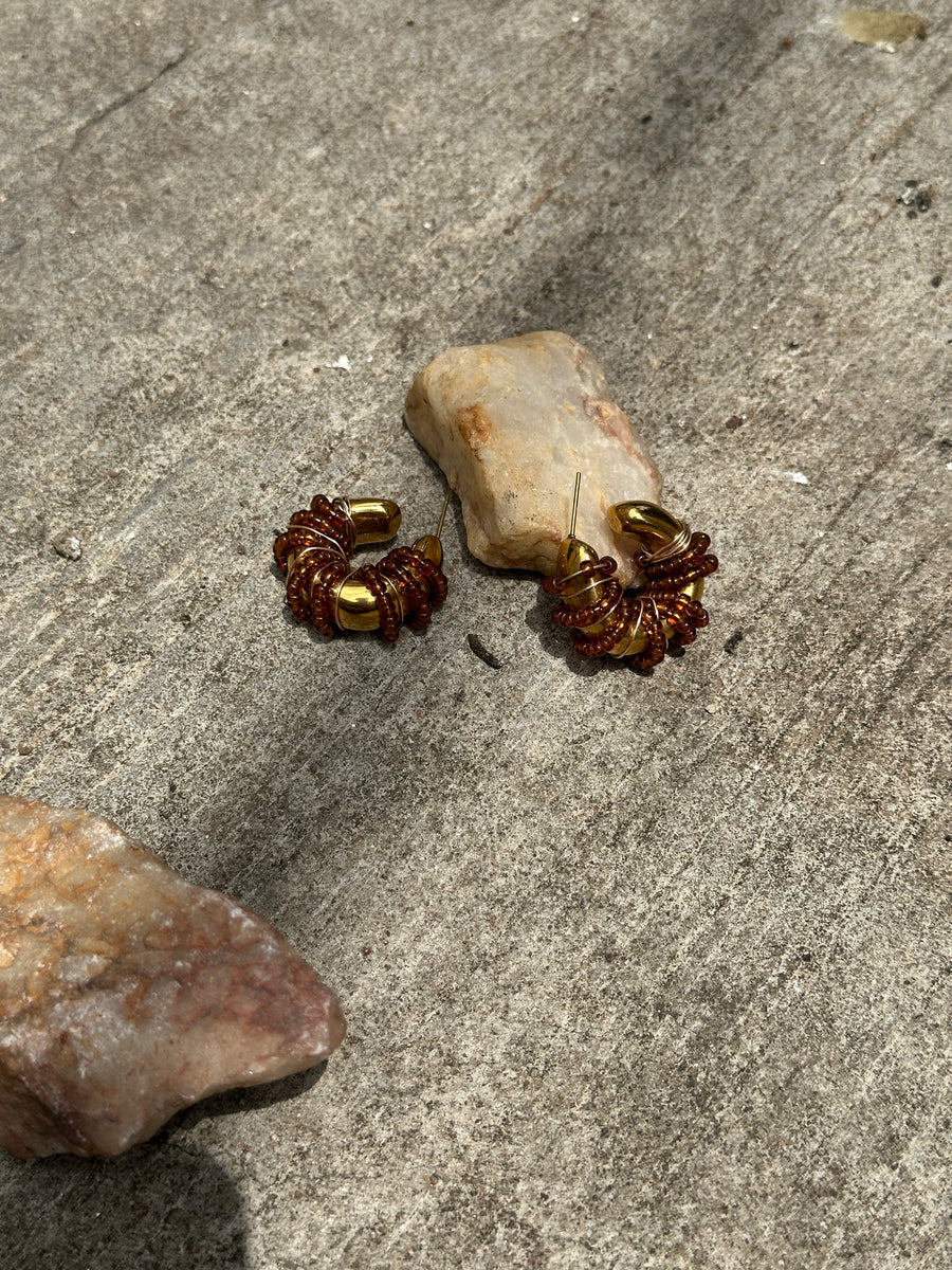 Renikeji Choc Chip Hoop Earrings with Brown seed beads wrapped around a gold-plated hoop