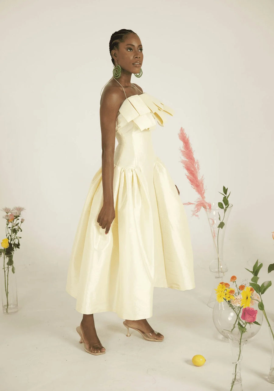 Desiree Iyama Makarios Midi Dress with Features a fitted bodice, elastic halterneck, exaggerated flaps at chest