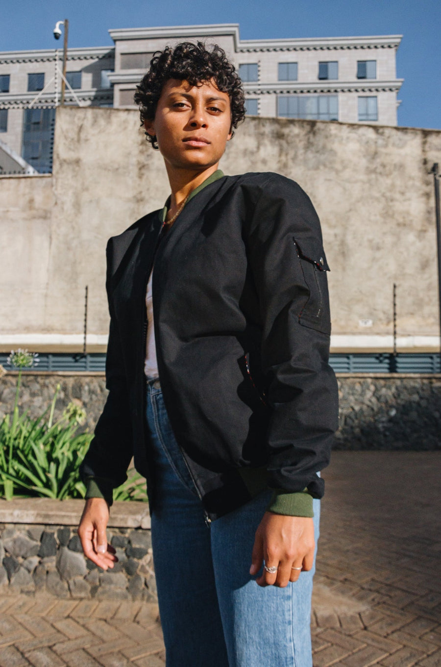 Mikono Black bomber jacket with four shoulder pockets and one inside pocket