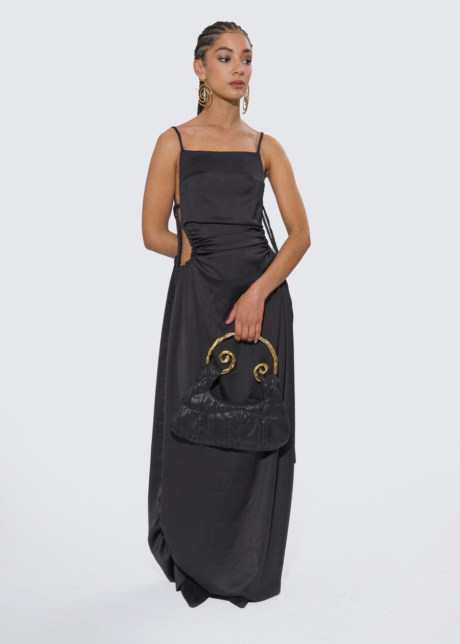 Olooh Laurene maxi dress with Bronze buttons adorning the side opening